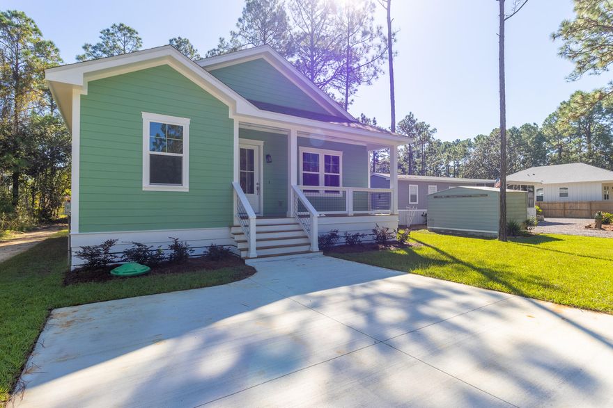 This beautifully finished 3 bed, 2.5 bath home offers 1,398 sqft of stylish comfort just 10 minutes from the beach! Featuring LVP flooring, tile showers, shiplap accents, vaulted and trey ceilings, crown molding, and a fenced backyard -- all with no HOA. Prime location near the bay and the future Chat Holley park & amphitheatre makes it perfect as a full-time home or a high-performing rental! Construction complete as of 10/1/2025! Seller will install a wood privacy fence with an acceptable offer. Watch the Youtube video here : https://www.youtube.com/watch?v=eKqJhctS40E