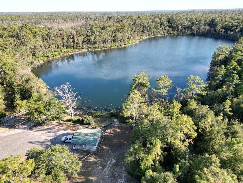 Love Golf? Dream of having a home built in proximity to your clubhouse and golf course without paying high HOA fees? This .525 acre lot is perfect for you. Other than the clubhouse and beautiful Green Golf turf, Sunny Hills offers numerous lakes with white sandy beaches and clear water throughout for recreational activities such as swimming, boating, and fishing, but also provides a short drive, approximately 45 minutes to Panama City beaches when you want to visit a different slice of heaven. Northwest Florida Beaches International Airport, and Pier Park shopping are approximately 45 minutes. Approx. 20 miles from local shopping, medical, and other local amenities in Chipley.