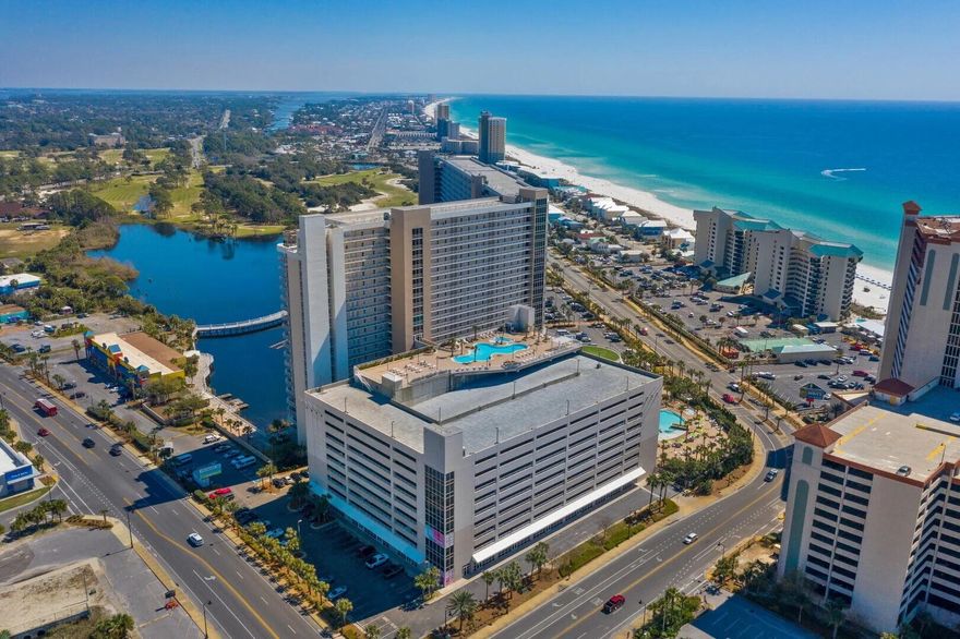 Located in Laketown Wharf, this condo offers breathtaking floor to ceiling views of the Gulf and endless amenities, including 5 resort style swimming pools. With contemporary style, the living space has plenty of room and fully equipped kitchen with brand new appliances and spacious dining areas. The large private balcony is perfect for dining or lounging. Ideal for vacation renting, this luxurious beachfront condo will not last long!