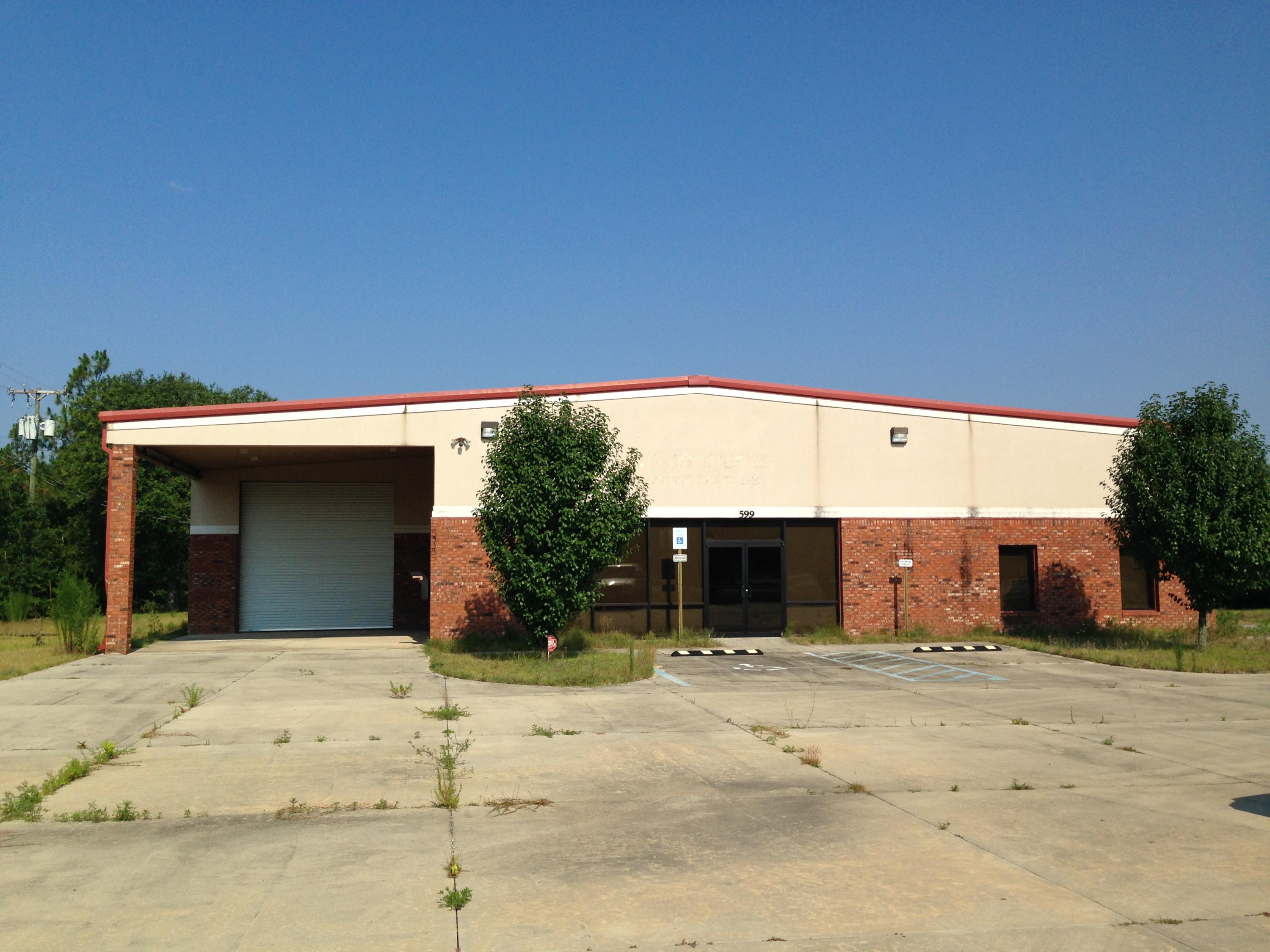 This building can accommodate a variety of uses from offices to manufacturing. Approximately 9,000 square feet of the building is heated and cooled, compressed air lines are located throughout the building, the floor is automobile showroom quality, 16 foot eve height, reception/lobby area in front of the building, private offices, and the south portion of the building is designed so you can drive an 18 wheel truck thru the building and so much more!!!! A must see this building is in like new condition and ready to move into.