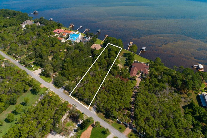 Price Improvement in exclusive Whispering Oaks Bayfront lot is tucked away at the West end of Forest Shore Drive. You are surrounded by an impressive footprint ranging from estates to contemporary Bayfront homes. This lot features over 100' of Bay frontage with endless Westerly views perfect for the Emerald Coasts infamous sunsets.New through road has been approved allowing for easy access to 98.If you are looking for privacy in a Non-HOA community within minutes to Grande Boulevard, shopping, and restaurants you have found your respite.Also, if school districts are critical then you are within close proximity to South Walton's elementary through high school locations.Last but not least Holiday Road is a direct access to your public Gulf of Mexico Beach access.