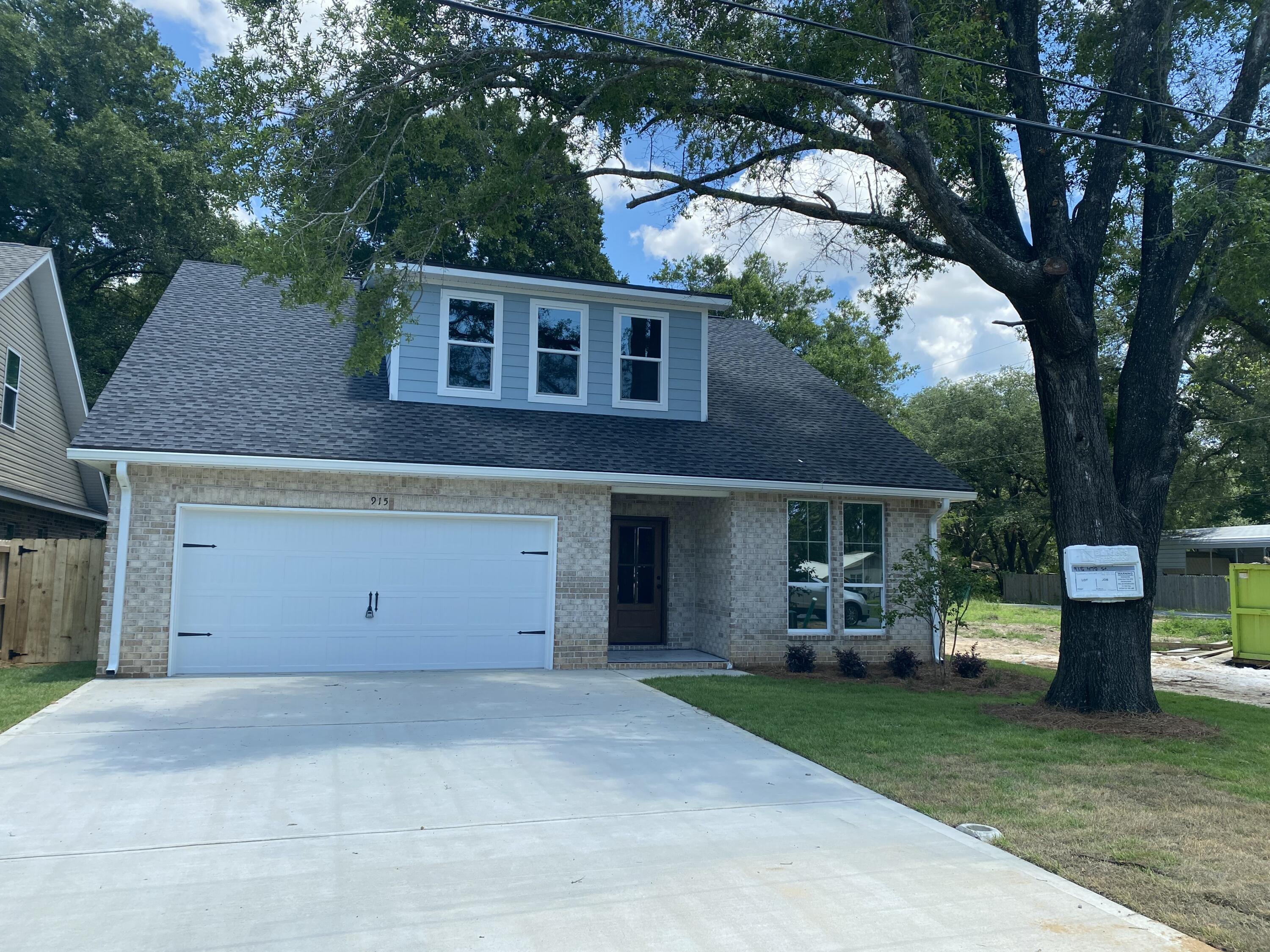 New construction in the heart of Niceville! This beautifully designed 4-bed, 2.5-bath home offers 2,348 SF of thoughtfully planned space with designer finishes throughout. The open floor plan features LVP flooring, black fixtures, a dedicated study, and a bright, spacious loft with abundant natural light. The gourmet kitchen includes quartz counters, natural/white cabinetry, a farmhouse sink, herringbone backsplash, and GE gas appliances. Enjoy 7-foot front windows that elevate curb appeal and fill the home with gorgeous natural light, plus an extra-wide driveway, covered porch, and extra-deep 2-car garage with workspace and sink. The luxurious owner's suite boasts a spa-like bath with tiled shower and pebble floor. Property appraised higher than list price--ask the listing agent for a copy! 4th of July Incentive - Builder is covering 2% of buyer's closing costs, doc stamps, title fees, final survey, fence, refrigerator, and your choice of blinds. Also included: a 4th of July Party Pack (Yeti Haul Cooler, Blackstone Grill, patriotic cornhole boards & $100 Walmart gift card) OR take an additional $1,000 toward closing costs or rate buy-down. Home will be completed by July 30th. Buyer must be under contract by July 4th and close by July 31st to qualify.