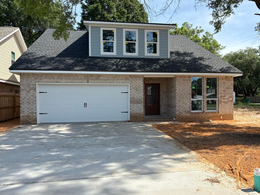 New construction in the heart of Niceville! This beautifully designed 4-bed, 2.5-bath home offers 2,348 SF of thoughtfully planned space with designer finishes throughout. The open floor plan features LVP flooring, black fixtures, a dedicated study, and a bright, spacious loft with abundant natural light. The gourmet kitchen includes quartz counters, natural/white cabinetry, a farmhouse sink, herringbone backsplash, and GE gas appliances. Enjoy 7-foot front windows that elevate curb appeal and fill the home with gorgeous natural light, plus an extra-wide driveway, covered porch, and extra-deep 2-car garage with workspace and sink. The luxurious owner's suite boasts a spa-like bath with tiled shower and pebble floor. Property appraised higher than list price--ask the listing agent for a copy!  4th of July Incentive - Builder is covering 2% of buyer's closing costs, doc stamps, title fees, final survey, fence, refrigerator, and your choice of blinds. Also included: a 4th of July Party Pack (Yeti Haul Cooler, Blackstone Grill, patriotic cornhole boards & $100 Walmart gift card) OR take an additional $1,000 toward closing costs or rate buy-down. Home will be completed by July 30th. Buyer must be under contract by July 4th and close by July 31st to qualify. 