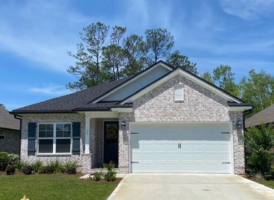 Located within walking distance to the Freeport Marina in beautiful Marina Village, this like new home offers 1883sf, 3 bdrs, a flex room with laminate floors and dbl doors, 2 1/2 baths. Brick exterior, covered entry, large covered, screened rear porch, 2-car garage, and  landscaped with sprinkler system. Interior upgrades: 9' ceilings, 8' doors throughout, crown molding, cased openings and windows, oil rubbed bronze package. Tiled shower and separate garden tub w tiled deck, double vanity & walk in closet in master. Laminate, tile and carpet floor coverings, kitchen back splash, ss appliances, granite countertops w/extended island/breakfast bar, ceiling fans, laundry room has upper/lower cabinets and sink. The home overlooks the private, wooded preserve. There are many amenities to enjoy.