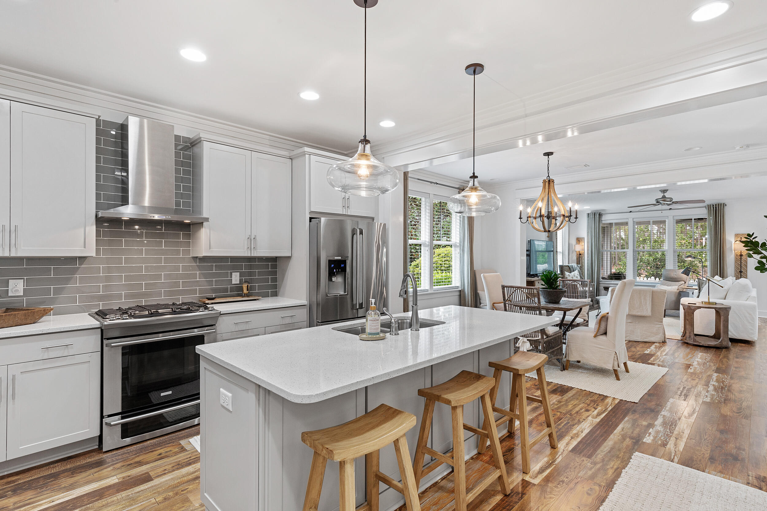 This immaculate home, built by Huff Homes, is a well thought out single level plan combining 3 bedrooms, 3 baths, with an open concept kitchen, dining and living room area, and screened-in back porch with a paved back yard offering views of the beautifully landscaped park.   The interior and exterior of this Begonia plan was freshly painted in May of 2022 and is positioned on a mature lot and is one of the premium homesites with a side buffer in the desirable Winter Garden phase of WaterSound Origins.  This rental restricted community offers the following amenities as part of your HOA dues:  Golf, tennis, pickle-ball, basketball, playground, volleyball, pool, fully equipped gym and canoe and kayaking on Lake Powell giving you access to row to the beach access near Camp Helen state park.