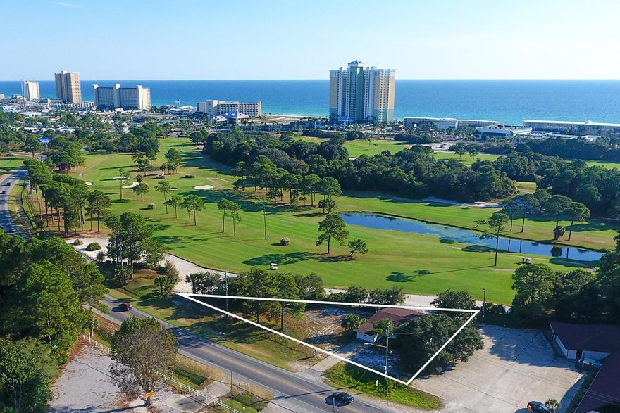 Centrally located in the highly frequented tourist friendly corridor of Panama City Beach, this property offers the opportunity to build on a level site overlooking the scenery of Signal Hill Golf Course. With over 240' of premium frontage on Thomas Drive and close proximity to the white sand beaches and emerald green waters of the Gulf of Mexico as well as other tourist destinations, this property is an ideal candidate for development. An existing office structure on the property allows for immediate use.