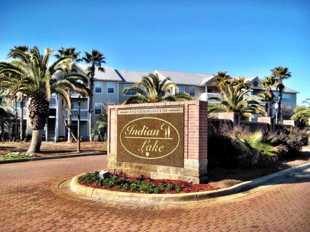 FANTASTIC OPPORTUNITY TO OWN AT THIS POPULAR DESTIN COMMUNITY! At Indian Lake you are close to the best shopping and dining on the Gulf Coast. This ground floor unit could not be more convenient. Gorgeous tile throughout means upkeep is a breeze! GREAT investment! Live in it, or rent it out - two spacious bedrooms and two full baths make this unit great for a roommate setup. The master walk-in closet is huge! Indian Lake has some fantastic amenities. Cancel that gym membership, because there is a full fitness facility on-site. The complex also boasts a pool, playground, and picnic area. For the pet-lover, there are several dog walk stations, and the property is right across the street from the best dog park in the area! This opportunity won't last long, so call today!