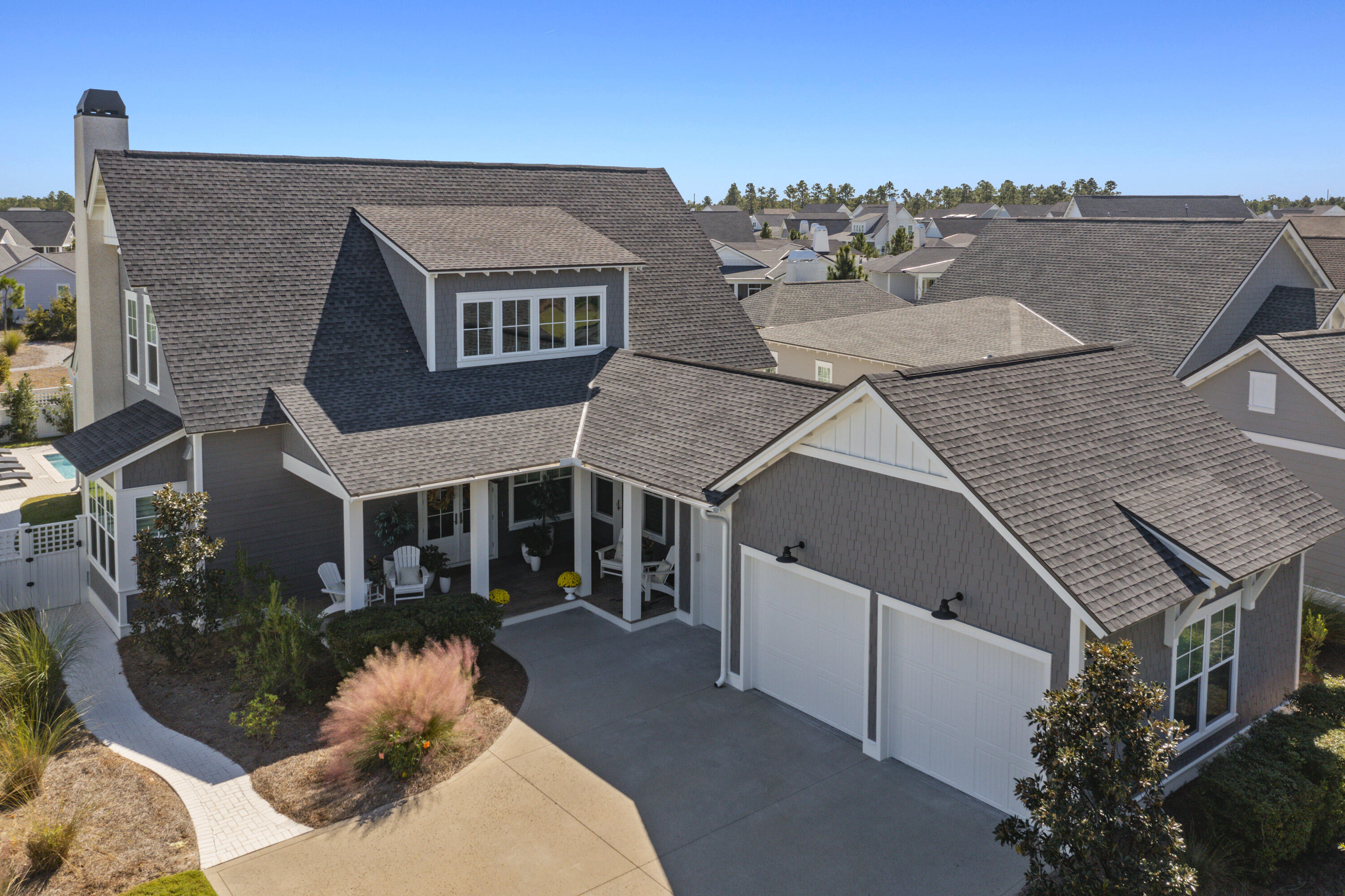 Stunning Romair-built home in Watersound Origins. This popular Weatherly plan features numerous upgrades and is located on a fabulous oversized lot with common area in the back of the home and forest and pond in the front. The spacious living and dining area boasts a gas fireplace, custom surround sound with Martin Logan speakers, and access to the large screened porch with summer kitchen, cumaru floors, & built-in heat lamps. The highlight of the outdoor living area is the inviting pool & spa and lovely cabana with wood burning fireplace. The gorgeous kitchen features top of the line appliances, including a paneled Subzero refrigerator & ice maker, eight burner Wolf range with double ovens, and quartz counters. Upgraded hardwood flooring and tile flow throughout the home The master suite is located on the main level and features a beautiful ensuite bath and a fabulous spacious custom walk-in closet with built-in vanity. Upstairs, there are three guest bedrooms with ensuite baths, bunk room with barn doors and built-ins, office/loft area, and added attic storage. Some of the numerous upgrades of this home include custom draperies & plantation shutters, wine & beverage center in customized laundry room, marble counters in laundry and all baths, cumaru decking on all porches, two car plus GOLF CART garage with custom flooring & cabinet storage system, NEW whole house generator, fenced yard for pets, gutter system, and much more!
The Watersound Origins community is a highly sought after neighborhood full of amenities including the Village Commons pool & fitness center, unlimited golf, sports courts, dock access to Lake Powell, parks & greens, miles of nature trails, and much more! Residents also enjoy close proximity (by bike or golf cart) to 30a as well as the Watersound Town Center which includes Publix, weekly farmer's market, medical offices, shopping, restaurants, and more!
