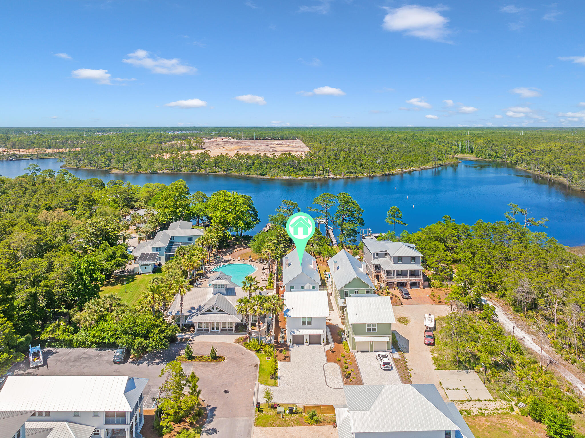 CUSTOM BUILT HOME | LAKE FRONT | NO HOA | CARRIAGE HOUSE | PRIVATE POOL | PRIVATE DOCK AND BOAT HOUSE located directly on Lake Powell. Approx 3,400 total square footage with a 4 bedroom 4.5 bath main house (2,730 sf) & a 1 bedroom 1 bath carriage house. This home has a bedroom & full bath on the main floor with an open living geared towards enjoying the pool & lake. The second floor features a master bedroom overlooking the lake with vaulted ceilings & a huge master closet. There's a second sitting room just outside the master with two other bedrooms. The carriage house features a vaulted ceiling, huge bedroom, & full bath with two vanities. Being sold fully furnished! Just steps from the gulf of Mexico and Inlet's public beach accesses. There is simply nothing else like this for sale.