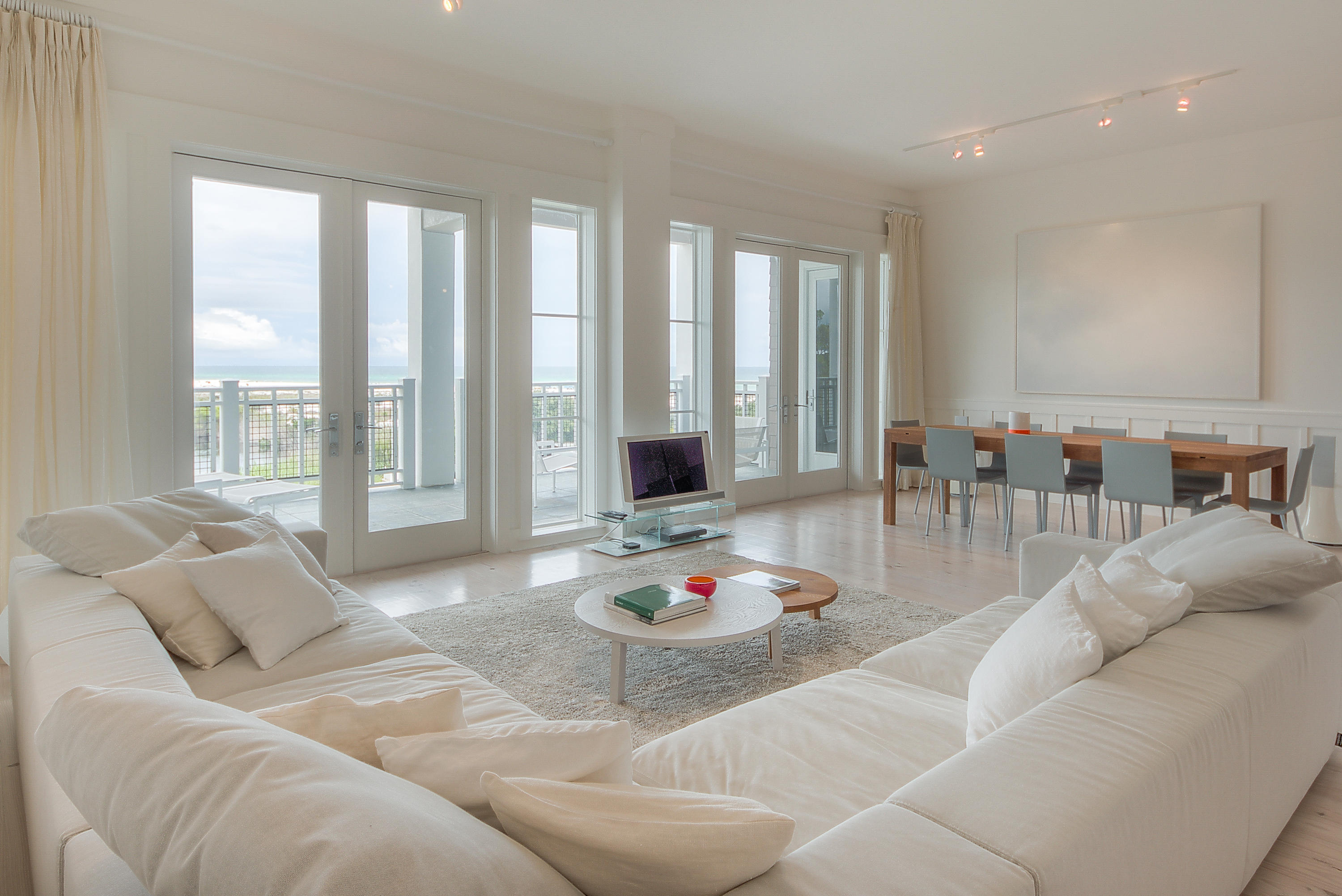A spectacular sophisticated residence with amazing gulf views from almost every room. A peaceful, inviting interior with high quality contemporary design pieces. Open, spacious one level floor plan offering 3 bedrooms and 3.5 baths. The kitchen boasts granite countertops, wine refrigerator and top of the line stainless steel appliances and is open to the main living nd dining area. Dining and living areas flow to the outdoor deep porch overlooking the infinity edge pool and gulf perfect for indoor/outdoor entertaining. Natural light fills the large master suite that includes separate tub & shower in bath and two walk in closets. The split floor plan design offers privacy with the two guest suites located on the west side of the unit. Built in desk and shelving between guest suites.