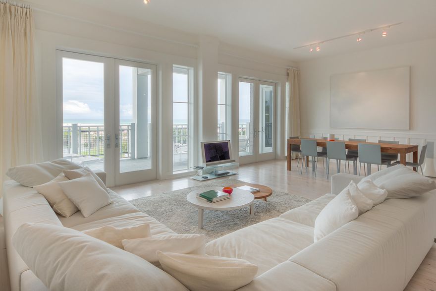 A spectacular sophisticated residence with amazing gulf views from almost every room. A peaceful, inviting interior with high quality contemporary design pieces. Open, spacious one level floor plan offering 3 bedrooms and 3.5 baths. The kitchen boasts granite countertops, wine refrigerator and top of the line stainless steel appliances and is open to the main living nd dining area. Dining and living areas flow to the outdoor deep porch overlooking the infinity edge pool and gulf perfect for indoor/outdoor entertaining. Natural light fills the large master suite that includes separate tub & shower in bath and two walk in closets. The split floor plan design offers privacy with the two guest suites located on the west side of the unit. Built in desk and shelving between guest suites.