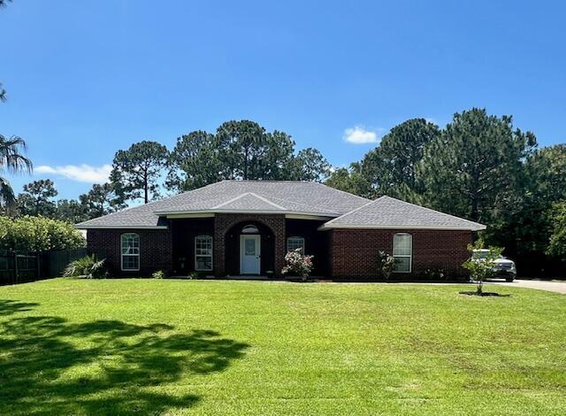 Check out this beautiful all-brick home with a large Front arched porch and rear covered Porch overlooking a large fenced in back yard. Inside it offers 3 bedrooms, 2 1/2 bathrooms, granite countertops throughout, and an additional room that can be used as a 4th bedroom or an office. This house, in the desirable Holley by the Sea neighborhood, is a very good location on a quiet street. Solar panels included to help with electrical bill. Pets may be allowed pending owner approval and pet fee. Call to schedule a showing!