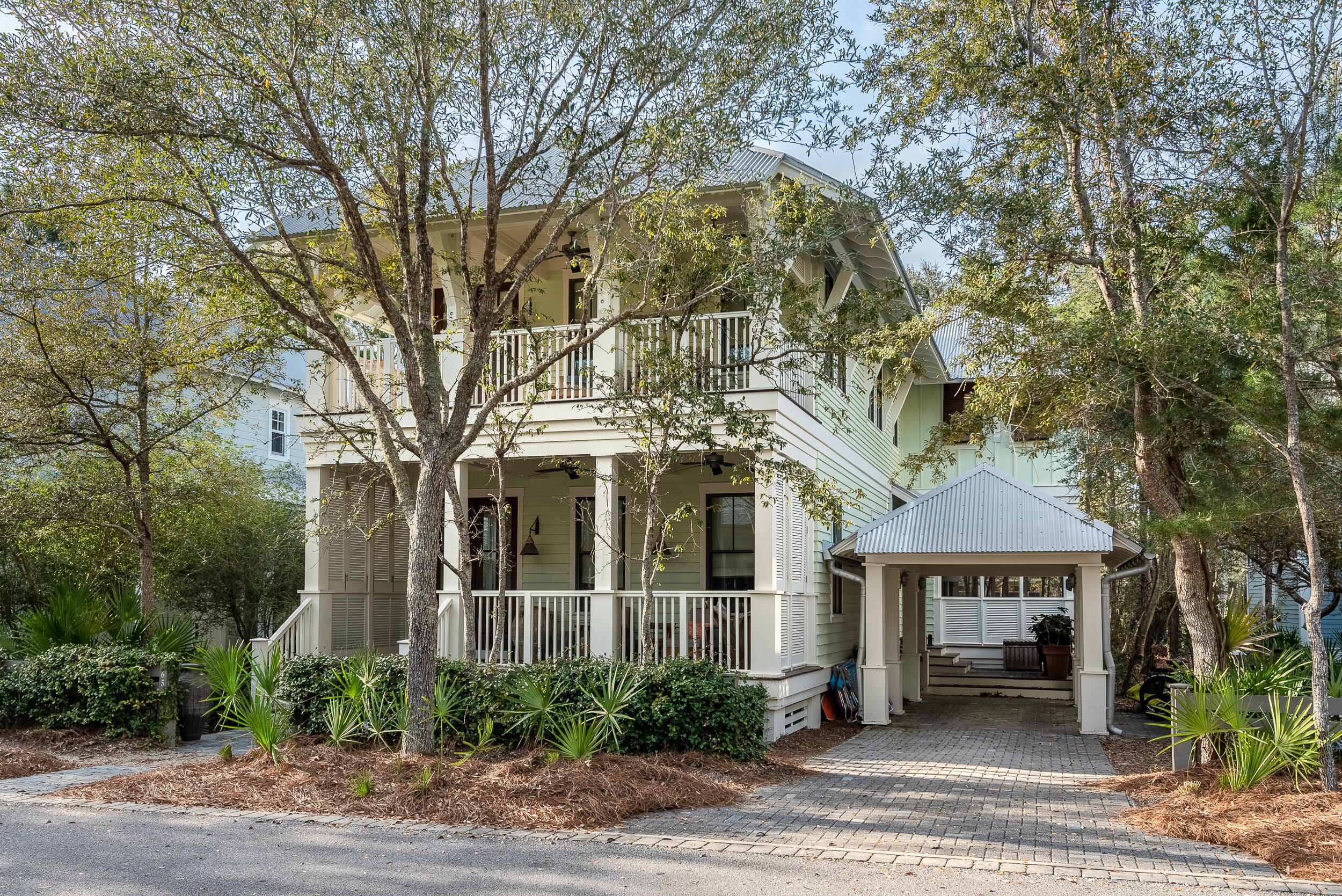 This Stunning, turn-key WaterColor home is prominently located in one of the most desirable locations of Phase II, situated graciously on the green of Camp WaterColor backed by a serene pond and Wood Fern Park. As you enter the home you are greeted with beautiful hardwood floors, high ceilings, shiplap walls and custom interior finishes throughout making a true craftsman. The open-concept floor plan is an ideal entertainment space with a chef's kitchen with top of the line stainless appliances, offering a large center island with a prep sink, butler's pantry, wine refrigerator and ample dining space. There is one spacious bedroom on the main level and a beautiful master suite with double vanities and a private balcony. Additional guest rooms are located on the second level, one with built