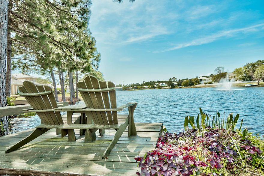 Single story waterfront home with garage. This lakefront location was chosen because of the view of the true spring fed lake and the cool breezes that flow off the lake all year round. The large screened porch, abundant lush landscaping, white picket fenced back yard and a social dock over Crystal Lake make this even more special. This custom designed homeis light and bright with three bedrooms and two baths. The open concept floor plan has a kitchen includes a custom island withgranite top and reclaimed wood that adds great character. A fireplace with wood mantles is the focal point of the living room and double sides into the third bedroom. The generous master bedroom has a wall of windows overlooking the lake continues to maximize the view and a sitting area.