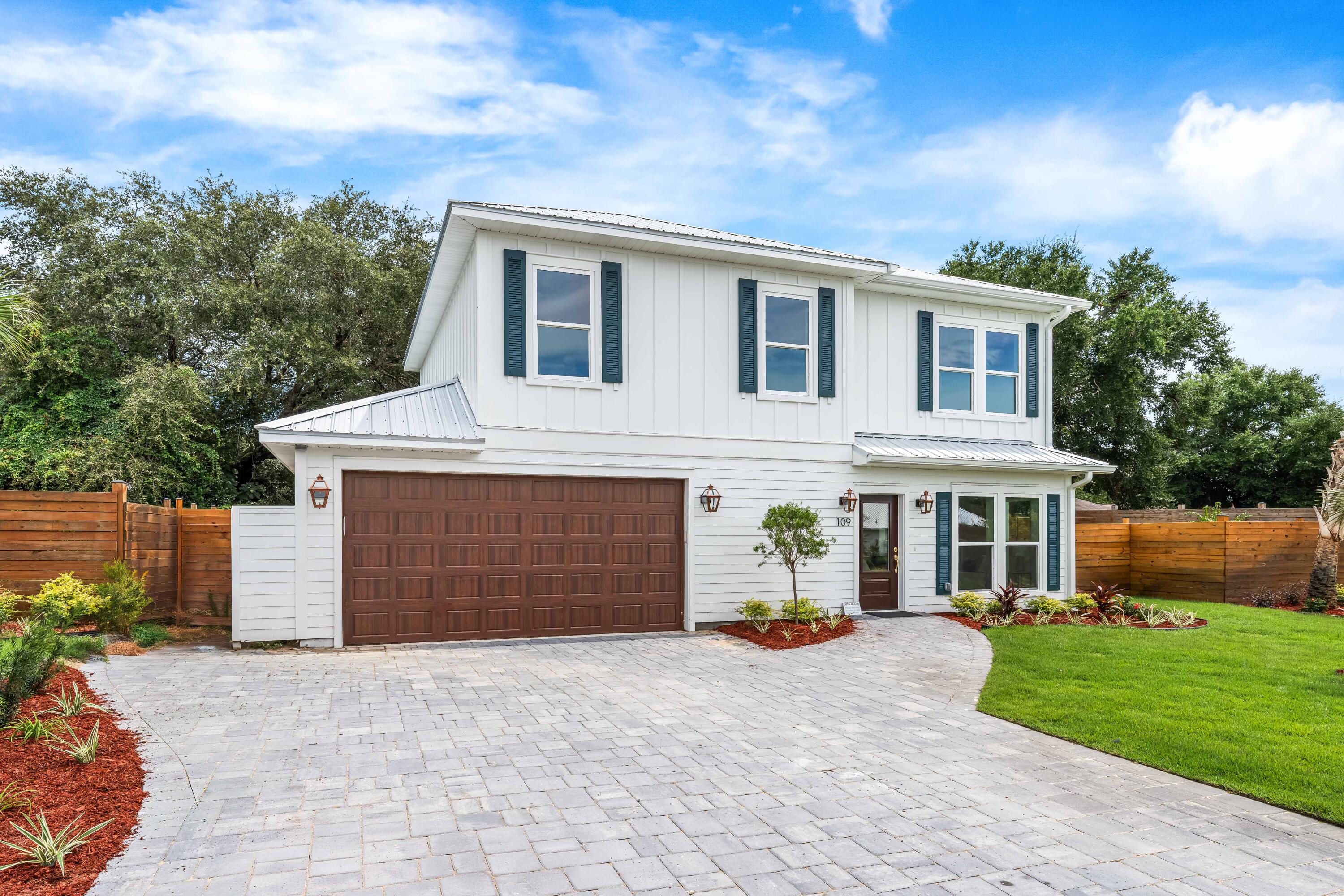 This premium lot and home feature numerous upgrades, including soundproof insulation between floors, an outdoor shower, metal spindles, and wood-stained stairs. Discover The Destin Cottages--a rare fusion of new construction and timeless charm in a gated enclave of just 12 coastal homes in the heart of Old Destin. Thoughtfully designed with farmhouse-style cement board exteriors, elegant paver driveways, and enchanting gas lanterns, these homes exude warmth and sophistication. Each residence boasts a full gas appliance package, Navien tankless water heaters with recirculation pumps, metal roofs, front porch gas accent lights, and luxury vinyl flooring throughout, all set against beautifully landscaped surroundings.