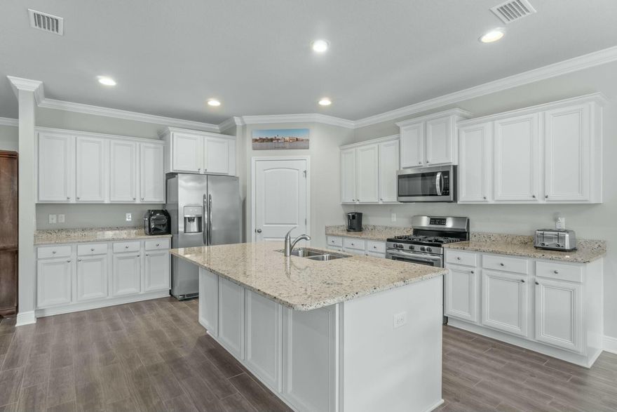 Welcome Home The Victoria FE model in Central Park at Hammock Bay! This stunning 4-bedroom, 2 1/2-bathroom craftsman-style home is ideally located just 18 miles from the beautiful white-sand beaches of the Emerald Coast. Featuring a spacious open layout, this single-story home includes a two-car garage, rear gutters, full irrigation, and a fenced backyard--perfect for families or guests. The thriving Hammock Bay community offers a wealth of amenities, including the Bay Club, pools, playgrounds, pickleball and tennis courts, basketball courts, a clubhouse, and a fitness center. Relax on the screened-in back porch and enjoy Florida's seasons while entertaining or unwinding in your private retreat!