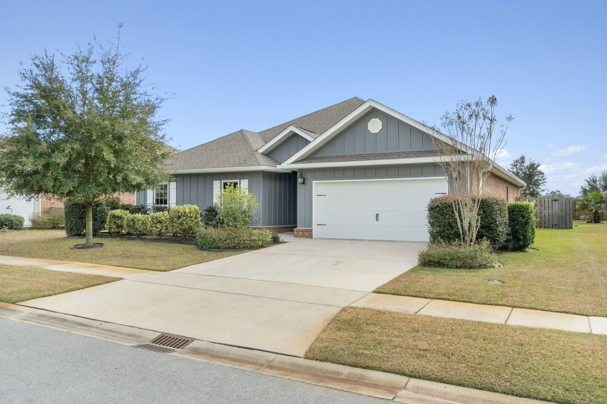 Welcome Home The Victoria FE model in Central Park at Hammock Bay! This stunning 4-bedroom, 2 1/2-bathroom craftsman-style home is ideally located just 18 miles from the beautiful white-sand beaches of the Emerald Coast. Featuring a spacious open layout, this single-story home includes a two-car garage, rear gutters, full irrigation, and a fenced backyard--perfect for families or guests. The thriving Hammock Bay community offers a wealth of amenities, including the Bay Club, pools, playgrounds, pickleball and tennis courts, basketball courts, a clubhouse, and a fitness center. Relax on the screened-in back porch and enjoy Florida's seasons while entertaining or unwinding in your private retreat!