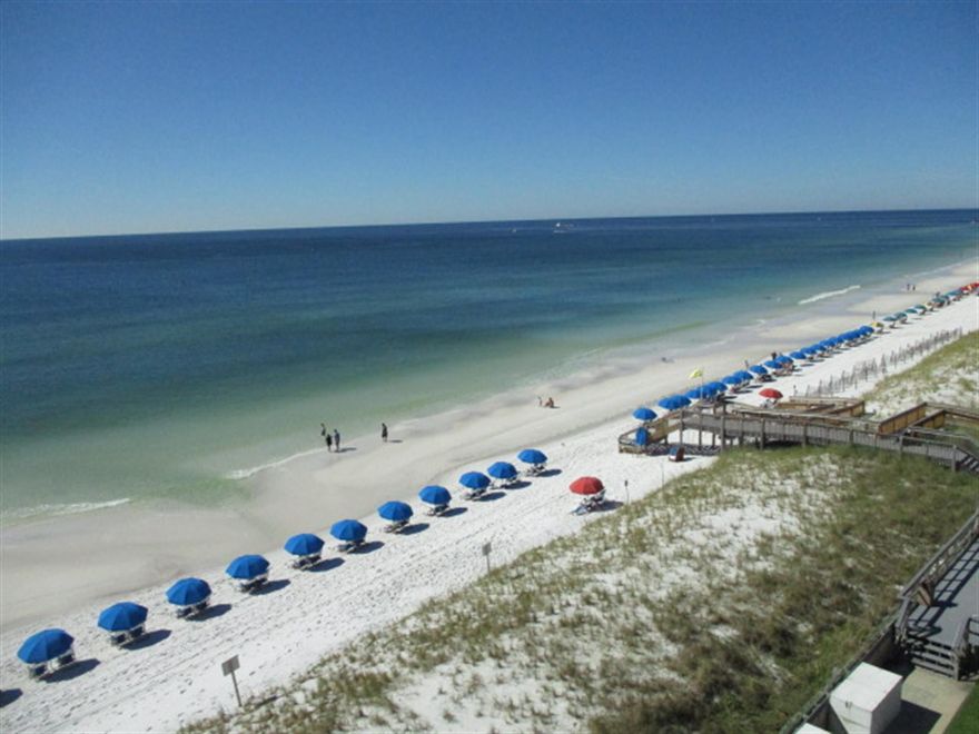 This 2 bedroom/2 bath condo which accommodates up to 6 people with a king size bed in master bedroom, 2 twin beds in the guest bedroom and sofa sleeper in living room.This 6th floor condo  offers its own private balcony with an amazing views of the Gulf, pool, and the sunsets! Unit has tile in the kitchen and bathrooms, with new wood flooring throughout the living room, dining room, and bedrooms. New storm doors.  It is themed in a rustic, coastal feel with vibrant colors and distressed woods. Featuring new kitchen counter tops, cabinets, bedding, and a brand new sleeper sofa, along with large flat Screen TV's in the living room and both bedrooms. Buyer to verify footage.  amenities include tennis courts,  exercise room, laundry room and a game room. Seller may do a 1031 exchange.