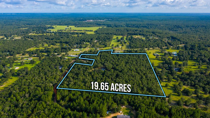 Almost 20 + acres of land just outside of town allows for quiet and peaceful country living.   This property is the perfect get away without having to sacrifice a commute.  Situated about 1/4 mile off the road is a 2/2 mobile home with a ramp leading up to the porch .  A great kitchen area features plenty of cabinetry and storage space.   A large master bath includes a soaking tub and a separate shower stall.  There is a private drive, plenty of space for parking, and no HOA to govern what you can/can't do.  If you're looking for your next peaceful retreat away from the crazy hustle and bustle of city life, come check this out today!