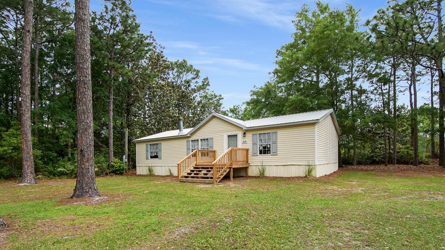 Discover the perfect blend of comfort and convenience in this delightful mobile home in South Walton's heart! Nestled on a spacious half-acre lot, this property offers privacy and plenty of room to roam. Whether you're an outdoor enthusiast or just love a cozy, move-in-ready space, this home is sure to impress. Centrally Located: explore all the nearby parks and attractions with ease. Boater's Dream: The nearest boat ramp is a few miles away, making it effortless to launch into the bay for a day of saltwater fishing, enjoying the scenic waters, or a trip to Crab Island.  Move-in ready: This three-bedroom, two-bath home has a new metal roof, hot water heater, fresh paint throughout, new fixtures, and a deck in 2024. An additional 400 square feet of living space is in an adjacent building. There is no HOA. All measurements are approximate, and Buyer/ Buyer's Agent is to verify all information and dimensions deemed important.  This residence is in a Flood Zone.