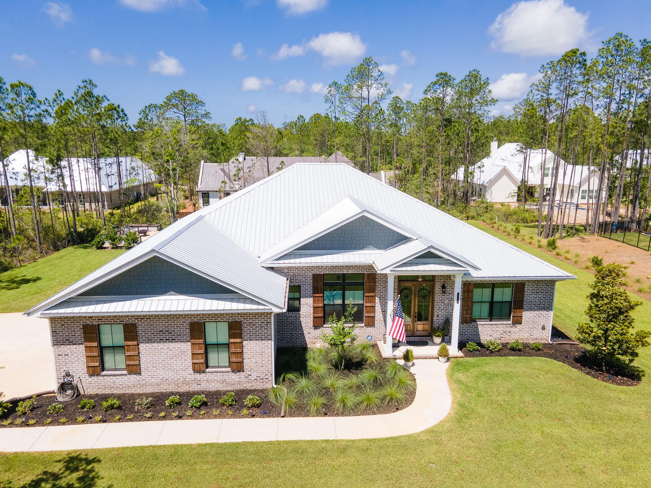 This beautiful custom home is located in one of the most desirable neighborhoods in Santa Rosa Beach. Seclusion Bay is a one-of-a-kind gated community with estate size lots and a community dock that sits on the Choctawhatchee Bay. This 4 bed/3 bath home has a well-designed open floor plan with custom finishes throughout. It features 12 ft ceilings in the living room/kitchen and 10 ft ceilings throughout the rest of the home. It has a spacious 2-car garage with epoxy floors and open areas for a work bench. Walk into the sizeable office that allows plenty of room to work privately.