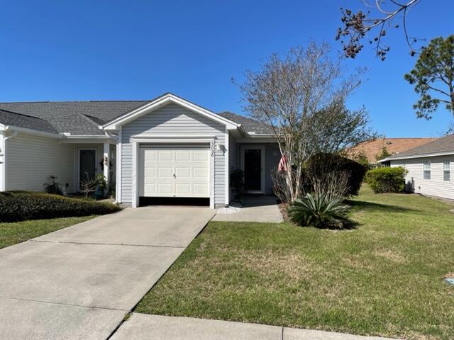 Fantastic townhouse in the always desirable Hammocks subdivision and lots of improvements in this unit including a new roof, new water heater, wood floors, stainless appliances and more. You will appreciate the open floor plan the moment you enter the home. The end unit has lots of natural light through the windows with plantation shutters, There is a dining area and open and bright kitchen. The enclosed sun room is heated and cooled an overlooks the charming paver patio out back and is a great place for reading or crafts with all the natural light. There is also a single car attached garage. The HOA dues cover the cost of the lawn care and sprinkler system as well. In addition, you have the use of the community pool.