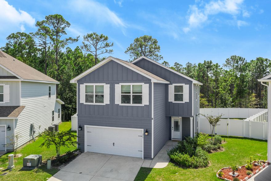 Experience the coastal lifestyle you deserve in this stunning and spacious home that is minutes from 30A beaches and situated on a quiet cul-de-sac in the popular Stonegate subdivision. This charming neighborhood of coastal-style homes with sidewalks is located conveniently to Grand Boulevard, Sandestin, Sacred Heart Hospital, Van R. Butler Elementary School, and the sugar white sands of the Emerald Coast. Enjoy world-class dining, boutique shopping, golf, and more! Built in 2020, this stylish 4 bedroom home is located on a prime lot that backs up to state forestry and has a large fenced-in yard with a patio and room for a pool! The well-designed "Abigail" floor plan has tons of natural light and neutral, coastal finishes, including granite countertops, engineered vinyl plank flooring, beautiful tile backsplash, stainless steel appliances, custom window treatments, and crown molding. The gourmet kitchen has an island for additional seating and storage, built-in microwave and oven, and white cabinetry. Storage on the main level includes a pantry, coat closet, and under stairs closet. Additional features include first floor powder room, two car garage, and irrigation system. The second-level master suite has a garden tub, double vanity, separate shower and a large walk-in closet. Three generously-sized guest bedrooms are located upstairs and one of them has floor to ceiling shelving. There is an additional full bathroom upstairs with a double vanity. The laundry is conveniently located on the second floor. This "Smart Home" includes a KwikSet lock, video doorbell, security system, and digital thermostat, which are all integrated with a touch panel. Call today for a showing! All photos with furnishings are virtually staged. Buyer should verify all information in this listing, including room sizes.