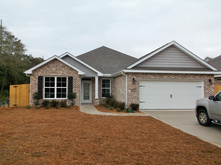 New Brick home with good sized yard, plenty of room for a pool.  4 bedroom plan so can use one for an office.  Kitchen has Granite countertops and spacious breakfast Bar open to Living Rm.  Dining Room. 9 Ft ceilings.  Rear covered patio.  The Primary bedroom offers tray ceilings & a beautiful on-suite bath w/marble garden tub and separate shower and double granite vanity.  Wood plank tile, carpeting in bedrooms.  Buyer to verify any & all areas of importance.