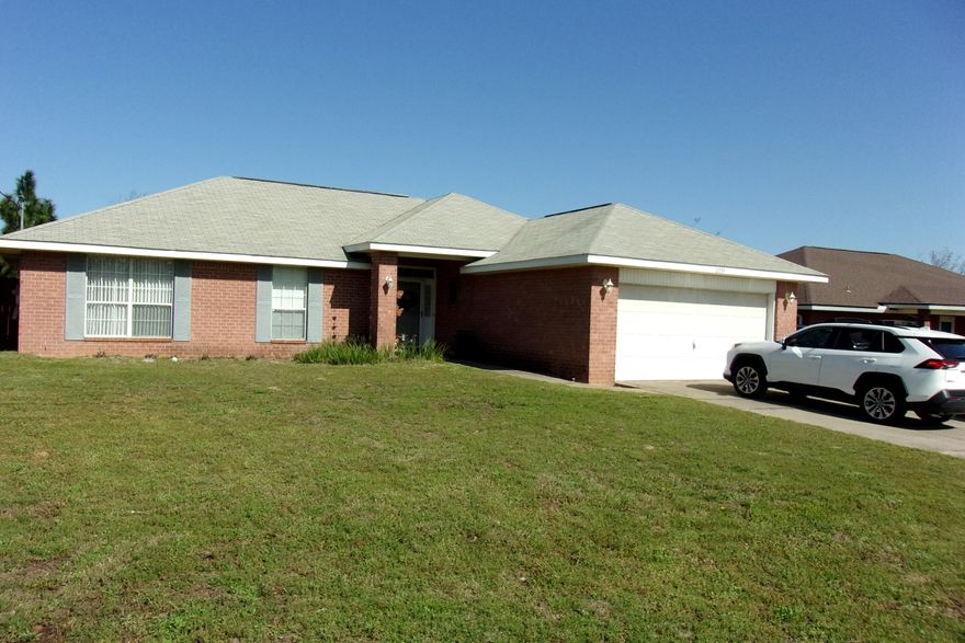 Well maintained home with lots of  upgrades~  All new stainless steel appliances, granite counter tops in kitchen and hall bath~ New vinyl flooring~  Extra parking pad~  All Brick 4 Bedroom and 2 baths~ Bathrooms have step in shower~ Woodburning fireplace in the living room~ Kitchen has breakfast bar and under counter sink~ Privacy fenced back yard, with patio and shop~  New roof being installed the first week in April~  This home is move in ready  Nice shop in the back yard~  Back yard is privacy fenced~]]r