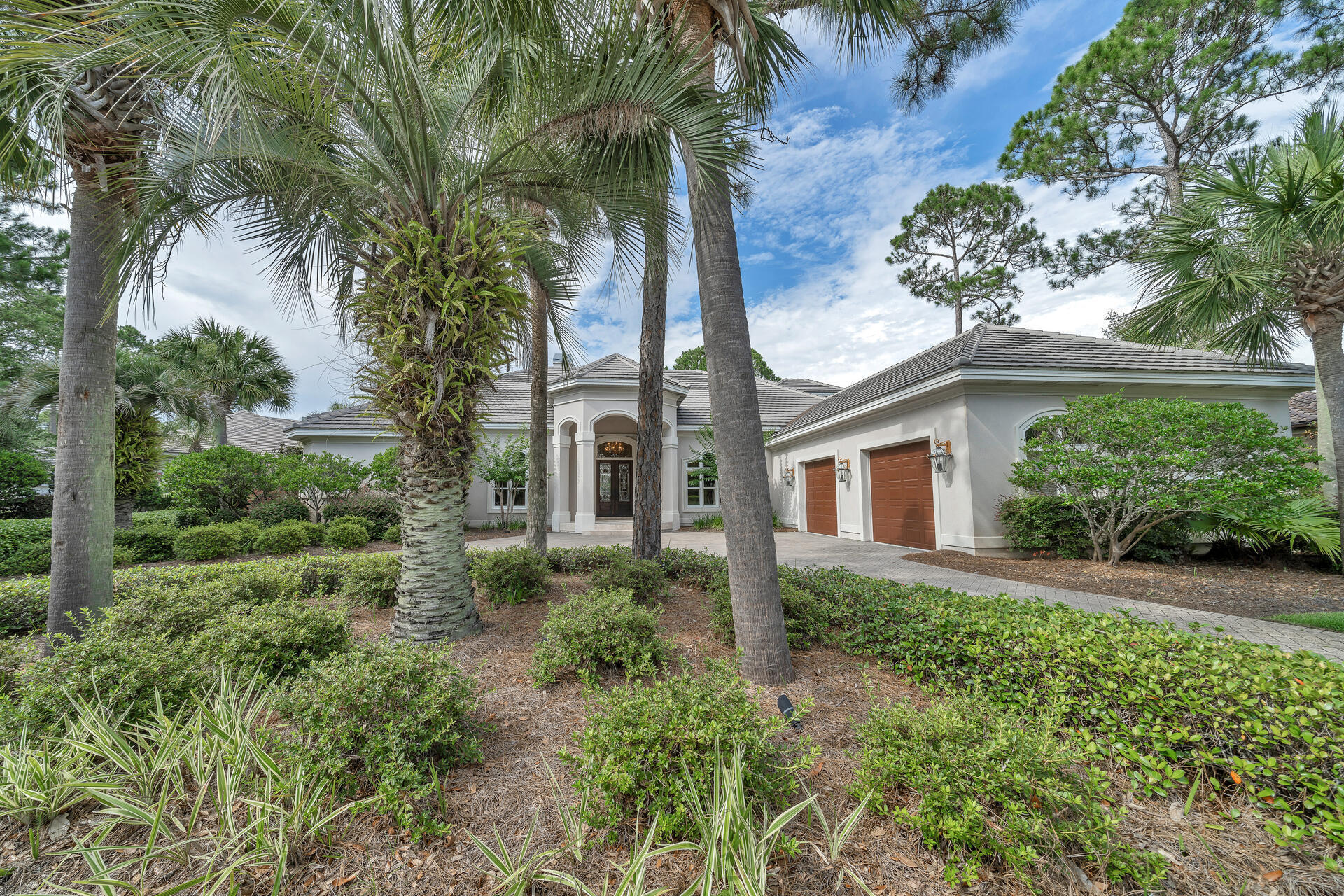 Elegant Boswell Builders custom built home in the gated community of Burnt Pine inside Sandestin Golf & Beach Resort. Welcome your guests through a portico entrance admiring leaded glass doors and transom into your Living Room. 18' coffered ceiling, built-in shelving around gas fireplace, views towards the hot tub and pool for starters.  12' ceilings in Family Room and tray ceilings in kitchen enjoying lots of natural lighting.  Entertaining is extended outdoors onto the covered lanai. Split floor plan allowing an office at front of home. Spacious master suite includes retreat area with gas fireplace and access to pool area. Dressing area with two large closets before entering luxury bathroom. 2nd Level Suite spoils guests with wet bar and attractive screened L-shaped balcony~