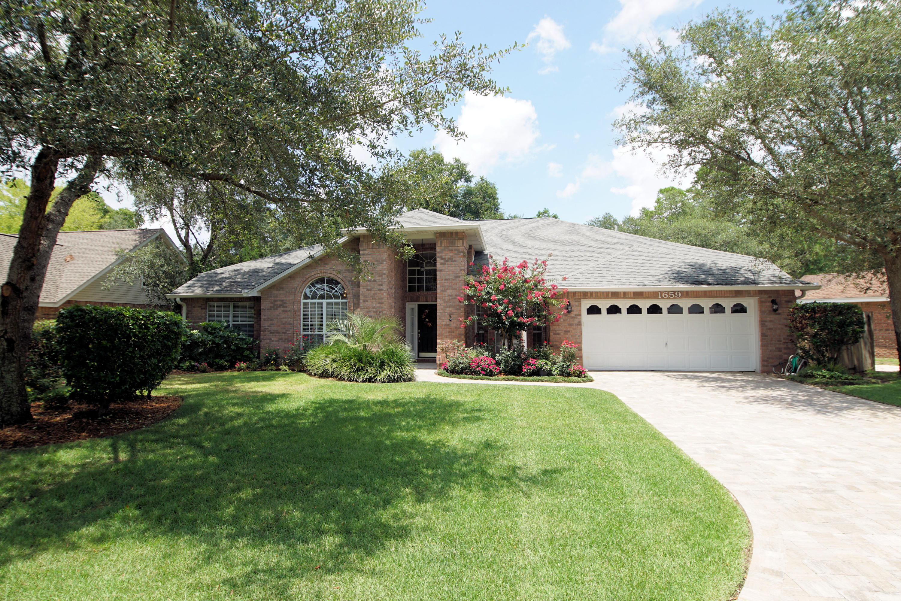 This is the location you have been looking for in Parkwood Estates!This all brick home has been lovingly maintained and upgraded. There are multiple living areas plus a formal dining room. The kitchen in the center of the home and has upgraded cabinets, quartz counter tops and a breakfast bar that overlooks the great room. Tall ceilings abound in this home,which adds to the open feel of the house. All bathrooms have been upgraded to incude vanities and lighting. There is an additional room at the back of the home that would be a great game room, playroom or exercise room.Backyard is stunning with mature landscaping, paver patio and Bullfrog hot tub. Lawn pump and sprinkler system too. AC and water heater have been replaced. The paved driveway has lots of parking for family and guests.