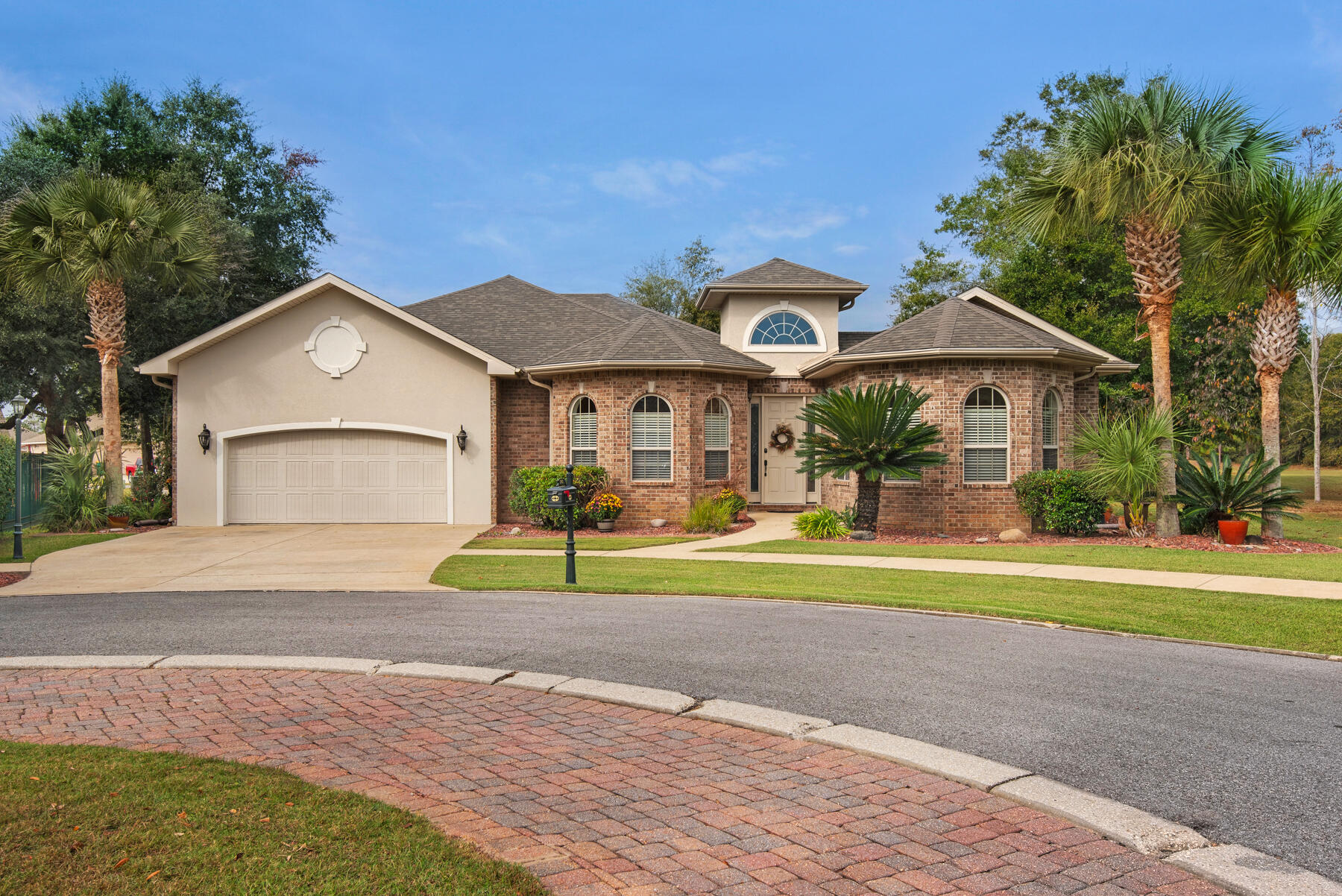 UNDER CONTRACT WITH 72 HOUR KICK-OUT.  Beauty and elegance define this home with 4 BR/3.5 baths at the end of a quiet cul-de-sac in the gated community of Chanan Estates. Owners have attended to every detail of this home improving it as recently as this year. Enter the home into the courtyard which comprises the heated pool, two gas firepits, and screened lanai overlooking the community grounds providing one with a serene and peaceful setting. The main house consists of the living area, dining room, kitchen, 3 bedrooms, and 2-1/2 baths. The studio is separate from the main house with private entry from the courtyard with a full bath and is excellent for the 4th bedroom or use as a private office. The main house has an open floor plan, high ceilings, crown molding, and tray ceilings. Decorative features include fine finish the home, tile flooring throughout, and is decorated with tasteful pleasing colors. The kitchen is open to the living area with island, pantry, fine finishes and cabinetry.   The large master bedroom suite boasts walk in closet, master bath, and opens to the courtyard.  Guest bedrooms are light and airy and accessible to a full bath. The exterior home is brick, with outdoor porch and grill area, two car garage, and beautiful curb appeal.  Buyer to verify all dimensions and homeowner dues.