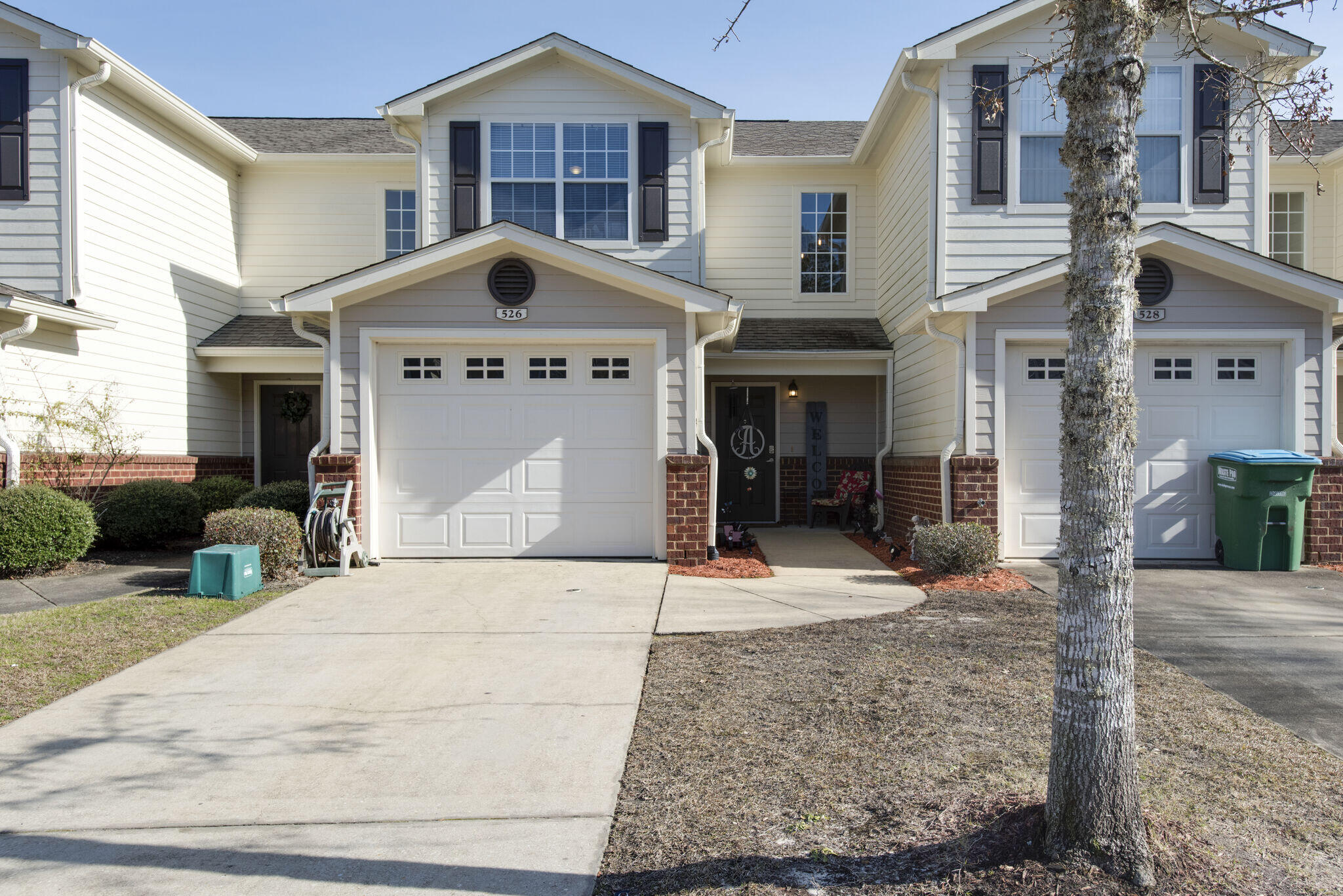 Welcome to Eagles' Landing!  Small townhome community North of I-10 in Crestview which allows you a quick commute to and from all the bases and the beach! The kitchen and combined living / dining area is open and bright with fresh paint and appliances.  This floorplan also features a 1/2 bath / laundry room combo on the main floor, while the 2 bedrooms are located up stairs, each with a private bath and walk-in closet.  The community features several playground areas, a community pool and lots of green space.  This particular unit has a large green space located right off of the living room.  This home is truly move in ready with fresh paint, flooring and lighting throughout.