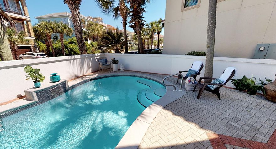 This exquisite home in Destiny by the Sea has been beautifully updated in 2018 with complete remodel of main level kitchen & 3.5 bathrooms where you will find quartz countertops, glass tiling & marble finishes. Travertine tiles line the rest of the home. The bottom has 2 bedrooms, a full size bathroom & kitchen, & access to the pool. The 2nd level hosts the main open concept living space which is open to the new, sleek, & contemporary kitchen that is adjacent to the master suite. A coffee bar welcomes you to the 3rd floor with 2 massive suites with their full size bathrooms. Comes fully furnished with exceptions of staging items.  Get this property soon to take advantage of the busy fall rental season! Renters love the location, large kitchen, and easy beach access in Destiny by the Sea.