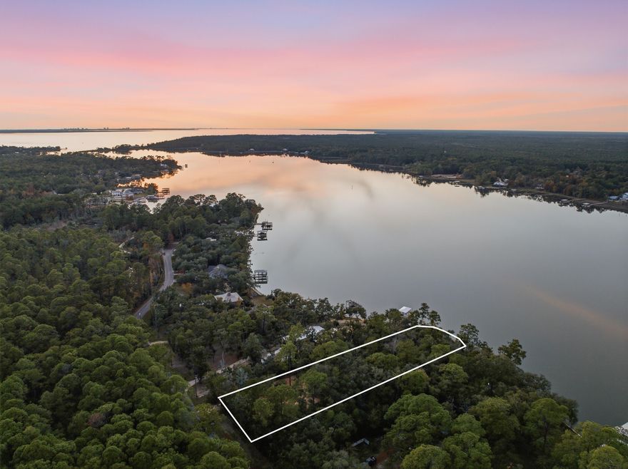 Rare Waterfront Opportunity on LaGrange Bayou-nearly one acre and 100' of deep-water frontage! Perfect opportunity to build your dream home on this partially cleared, premium lot with no HOA restrictions and direct access to Choctawhatchee Bay. Positioned to capture some of the most breathtaking sunsets on the Gulf Coast, this property offers an unmatched combination of size, privacy, and convenience. Enjoy the freedom to design exactly what you envision with no build-out time. Just minutes from dining and shopping in the heart of Freeport and only 20 minutes from the sugar white sands of 30A, this location truly offers the best of both worlds. Whether you're seeking peaceful Bayou views, easy access to coastal living, or a place to create lasting memories, this lot is ready to make your waterfront dreams a reality. 