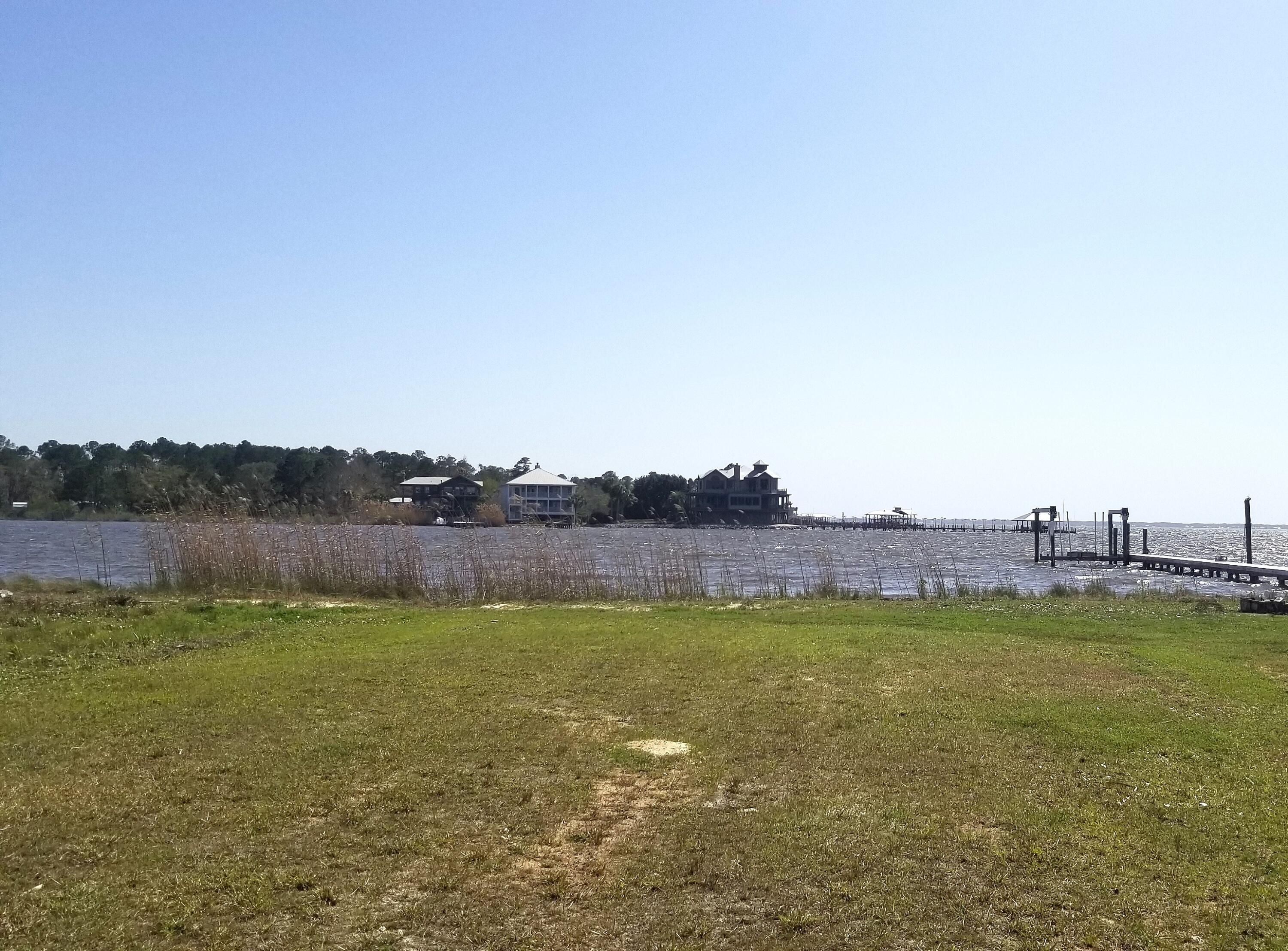 Bay Front Lot With Absolutely Beautiful, Unobstructed Water Views! Watch The Lights In South Walton With Views West Towards Destin, East Towards 331 Bridge & Beyond. Great Level Lot Which Appears Raised & Ready For You To Build Your New Home. Lot Has 60 ft of Waterfront & Is Approx 200 ft Deep From Road To Water. No HOA Restrictions In Order To Construct Whatever Walton County Will Allow. Freeport Is Bustling With Publix Grocery Store & New Businesses In Town. The Beaches Of South Walton Are Just 18+ Miles Away. It Is The Best Of Both Worlds. By Boat Cross The Bay To The Bay Restaurant Or The North Bay Social Club. From Freeport To The West Is VPS Airport & To The East Is ECP Airport. Interstate 10 Is 19 Miles North. You Should Check Out This Waterfront Lot Soon!