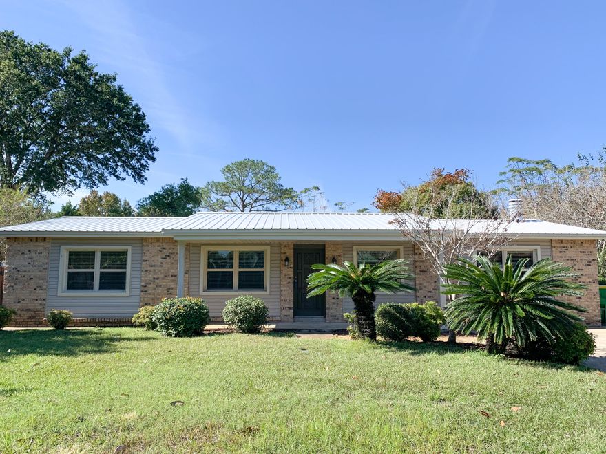 Updated home tucked away in quiet neighborhood located within minutes of Fort Walton Beach's central shopping and entertainment area. Easy quick drive to bases AND beaches, All brick home with vinyl accents, updated in 2017/2018 with new windows, HVAC, vinyl plank flooring in living room, painted throughout, kitchen updated with new appliances, tile backsplash and granite countertops, sink and faucet, painted cabinets. Bathrooms updated with,new faucets, tile surround tub, new gel coated shower. Home has all new lighting and fans, recessed lighting, new metal roof, newly screened porch, blinds. Sprinkler system installed and sodded. Sit on the screened back deck and look out on the pretty privacy fenced backyard, or work in the workshop with electricity. Inside laundry & utility room .