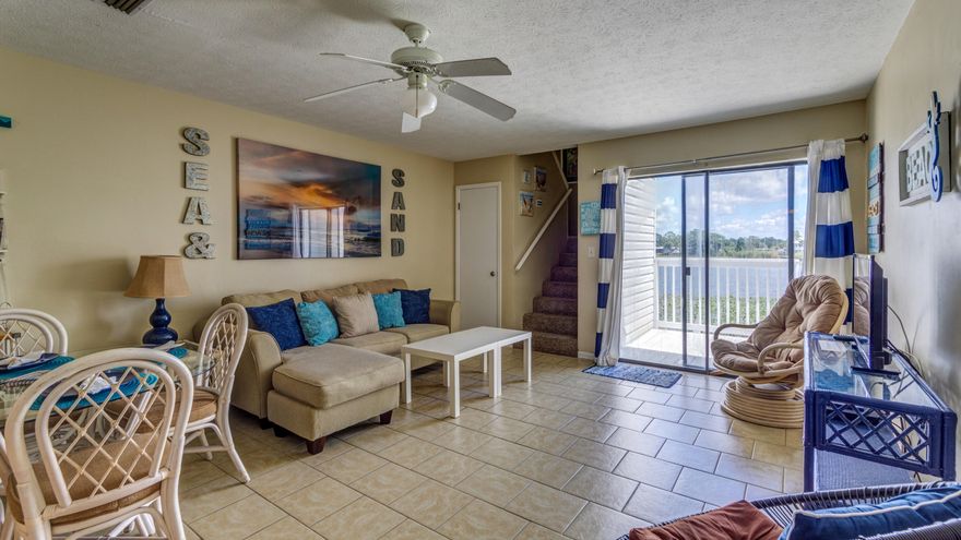 CURRENTLY UNDER CONTRACT, SELLER ACCEPTING BACKUP OFFERS. Beautifully updated waterfront condo located on Lullwater Lake. Located on the quiet west end of Panama City Beach, this 2 bedroom 2 bath condo is very close to the beach. Condo is located on the 2nd floor and there is a master bedroom located on the 3rd floor within the condo.Complex includes in-ground pool situated next to the lake, shuffleboard, dock, and fishing. Conveniently located near Pier Park with easy access to 30a and the airport.