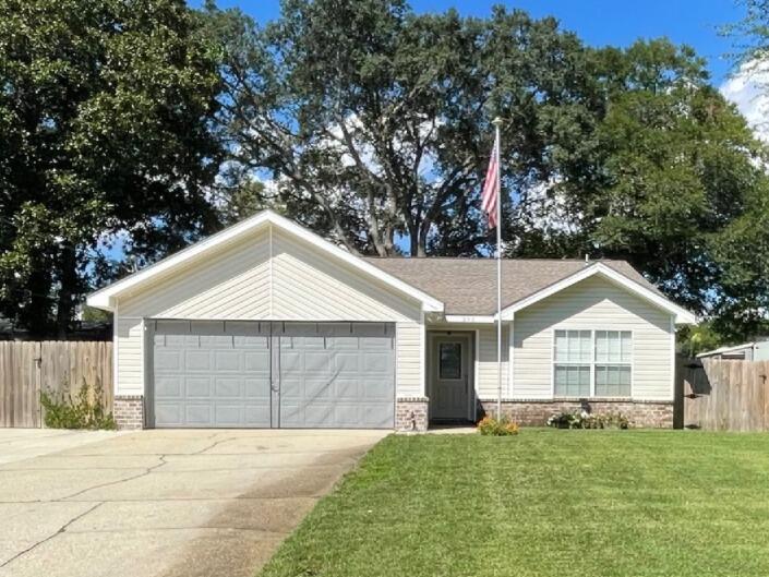 Year Round Swimming! New Gas-Heated Inground Pool! Beautifully landscaped home in the Garnier's Beach area of Fort Walton Beach. Extra wide parking plus double garage. Room for RV or Boat! Split-bedroom plan, two guest bedrooms share a full bath and the large master bedroom has a private bathroom. The kitchen is gorgeously appointed with quartz counters, white cabinetry, lovely turquise backsplash, high ceiling with recessed lighting, and a stainless steel appliance package. A pass-through from the kitchen opens to a breakfast bar adjoining the living room. Open and bright with natural light flowing in, the comfortable living area is the heart of the home connecting all. Then through french doors you enter into a Florida room. The Florida room is heated and cooled with a Mini split, but also has wall to wall screened windows with easily removable framed covers so on those wonderful fall and spring days, the breeze can be enjoyed. To top it all off, the private backyard is an oasis. Lovingly landscaping surrounds the pool including gardenia, Bird of Paradise, roses and more for a subtropical feel. Both the front and backyard have Zoysia grass which is spongy and soft. You will love walking barefoot on this grass. Pavers surround the pool, which is 6' deep, gunite, gas-heated and salt-water. The best of the best. A trickling rock water fountain is the focal point of the exquisite sinuous pool. There is also a side patio perfect for a hot tub on the garage side of the home with a doorway into the garage. The garage is multi-purpose with screens to cover all doors to create an additional space for entertaining. This home is zoned for single-family but would be great for short-term rental income too. Professional photos coming soon.