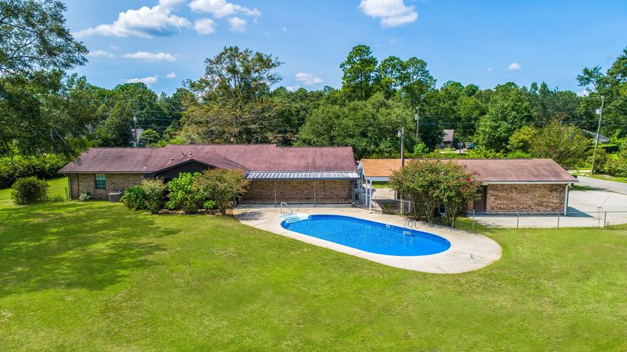 Nestled in the neighborhood of Woodbine Hills, this 4 bedroom 3 bathroom ranch style home has a FULL In-Law suite with a private entrance, pool and an abundance of entertaining space! With over an acre on a corner lot and no HOA, you'll have plenty of space to spread out and store all your toys with a 3 car garage. The kitchen comes equipped with a breakfast nook, breakfast bar with a fridge with ice maker and water dispenser, pantry and additional storage with a new dishwasher. Just off the kitchen you'll find a formal dining room and a large living room with vaulted ceilings. Three of the bedrooms are located on the right side of the home, opposite the in-law suite allowing for privacy. The in-law suite has a separate living space from the bedroom, a full bathroom with a convenient walk-