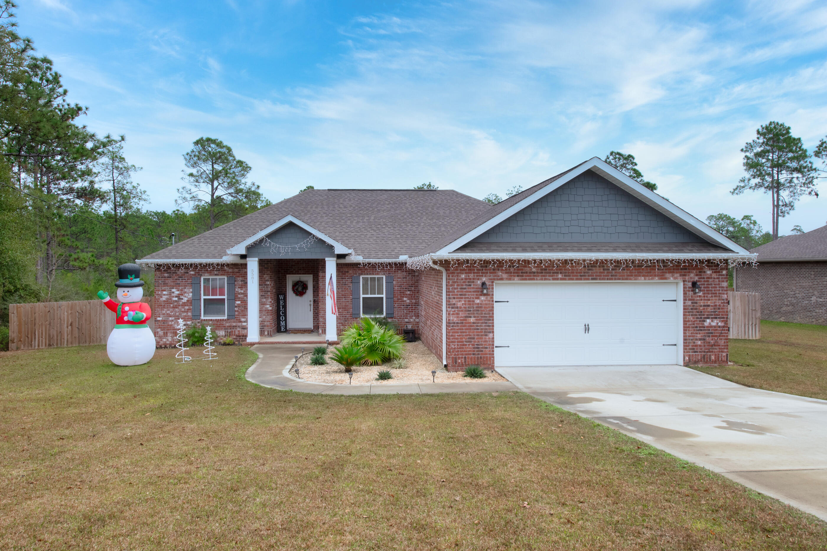 Parade of Homes winner built this gorgeous 4/2 home! Featuring 10 foot ceilings with tray ceiling in primary bedroom as well as large bathroom with double sinks, granite countertops, separate garden tub and tiled shower! Granite continues through kitchen along with stainless steel appliances and well sized pantry complimented by semi custom cabinetry, as well as open floor plan in which kitchen overlooks living and dining area. The home also features a separate laundry room with shelving. This home sits on a .96 acre lot with a fenced backyard/ deck overlooking nature and two car garage! Schedule a walkthrough today!