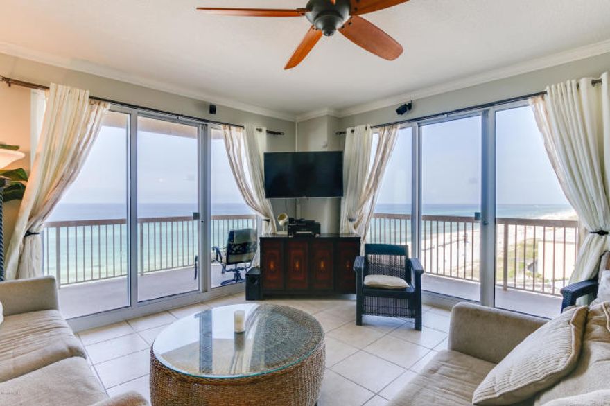 This exceptional, 1,577s.ft. condo lives like a house but comes with all the benefits of owning a condo. Conveys with luxurious beach inspired furnishings and artwork that welcome you to lie back and relax with views of the beach and ocean. The fully equipped kitchen features upgrades such as solid granite kitchen countertops & custom backsplash. New HVAC and fresh pain in 2018! Upgraded with ceramic tile in living area! The sunrise and sunset views from the 46' private, western facing, wrap-around balcony are a perfect end to a sunny day and beginning to an exciting evening - the ultimate in alfresco living! This massive condo has 3 bedrooms & 3 full bathrooms. MAIN MASTER BEDROOM is front and center on the beach with access to the main balcony and private bath with garden tub.