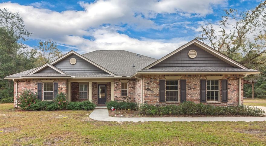 Country Living at it's Finest w/ this beautiful all brick 4 bd/2.5 ba home situated on approximately 3.25 acres. Inside you will find a well maintained home with an open floor plan, tile floors and neutral colors throughout. The spacious living room is inviting and open to the dining area and large kitchen with breakfast bar and tons of cabinet space. The huge master suite has a walk-in closet and an access to the covered rear back porch. Master bath features dual vanity, tub and separate showing. The additional bedrooms are all a nice size. The home has plantation shutters throughout and security system. Pole barn out back with power hook-up and level ground on this property which can be a rare find. Buyer to verify all areas of importance.