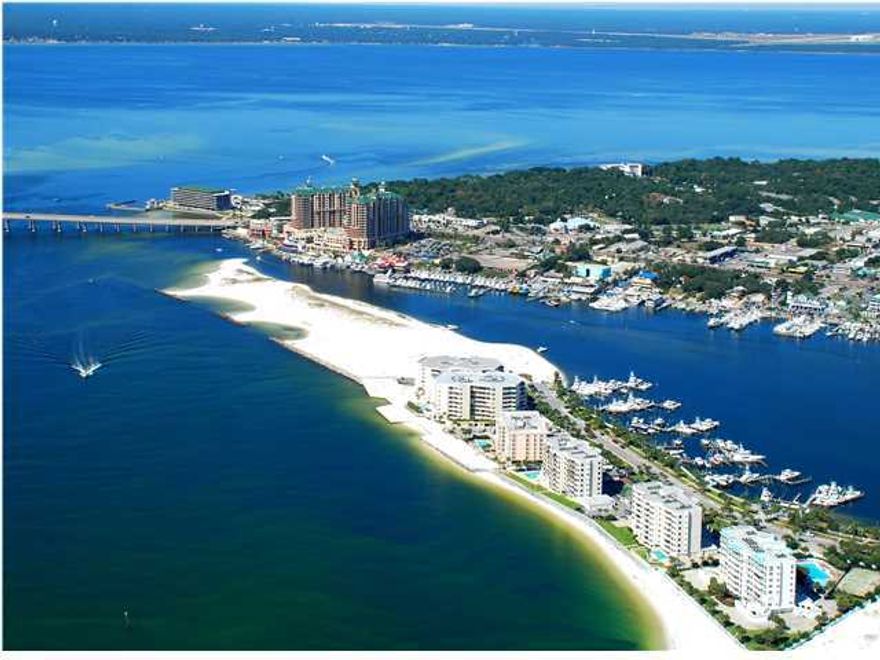 Welcome to Destin's East Pass where the Gulf of Mexico meets Choctawhatchee bay and the harbor. East Pass Towers offers unbelievable water views and sunsets. This beautiful unit has been completely renovated. It offers new tile flooring, granite counter tops throughout, kitchen cabinets, stainless steel appliances, mirrored walls, paint and plush furnishings. Each room has its own view and balcony! Just steps from the pool and the beach. The complex offers a pool, community & fitness room, marina, covered parking and a gated entrance. A large boat slip (C-4)is available with this unit at an additional cost. Great rental!