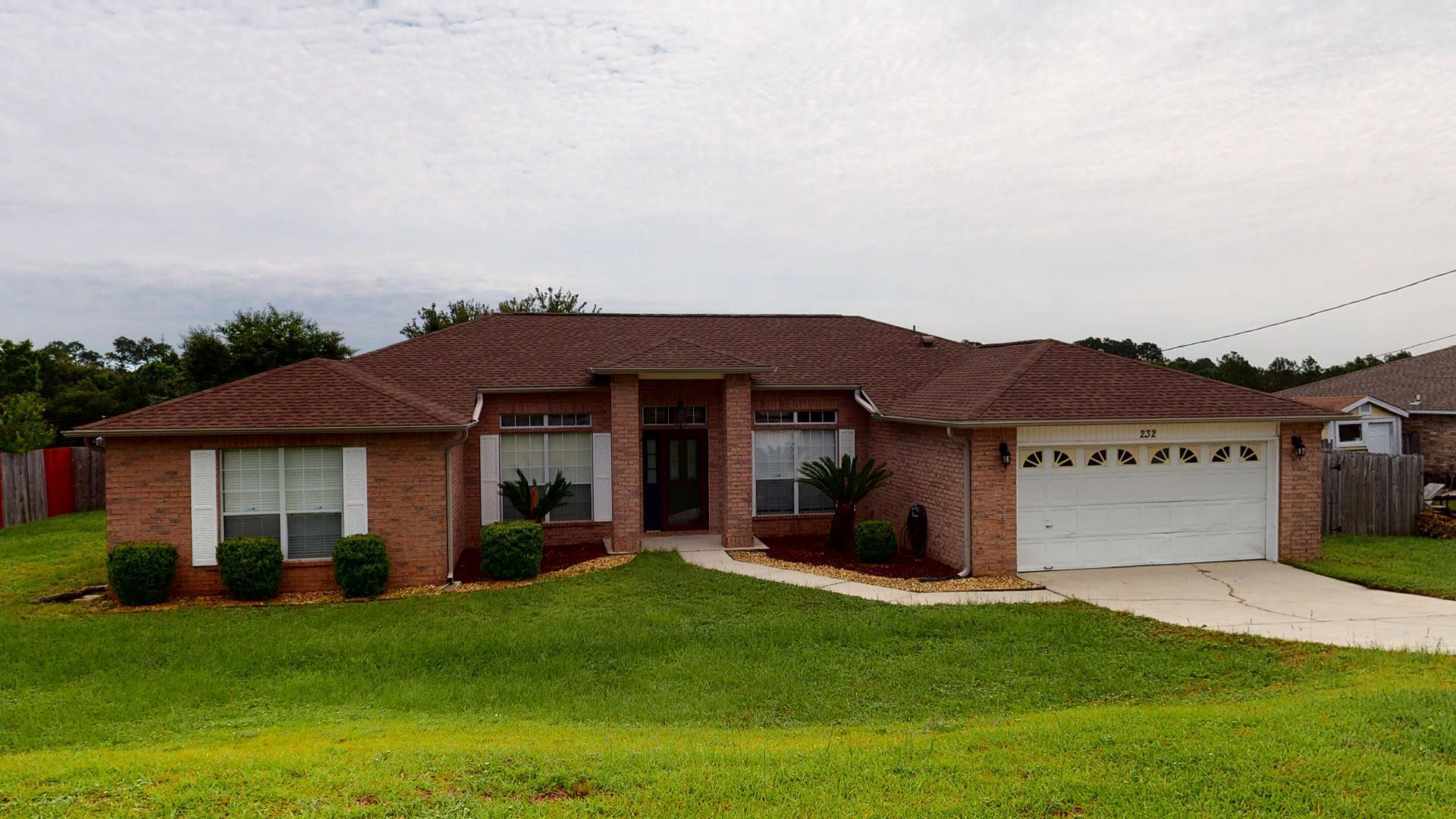 Beautiful all brick home, located South of I-10. This true 4 bedroom, 2 bath home offers spilt floor plan, with an office and dining room. Tile floor through out most of the home, carpet in 3 guest bedrooms. Large eat in kitchen with island, plenty of cabinets, tile backsplash, pantry. Large master suite with tile floors, the master bath has dual vanity, garden tub and separate shower, two walk in closets and tile. Ceiling fans in all the bedrooms. Enjoy your evening sitting on the nice wooden deck off the living room. Home is in a great location for those traveling to Duke and Eglin Field.