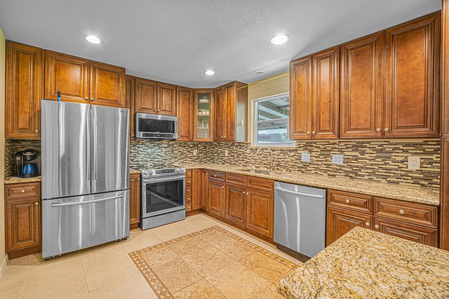 This beautifully maintained home, owned by a single owner since its construction, boasts numerous updates. The kitchen and bathrooms have been remodeled, the ceilings redone, the windows and doors replaced, and easy-to-maintain tile flooring installed throughout. Additionally, the property features a full RV hookup. Enjoy the convenience and charm of this lovely home in a prime location.