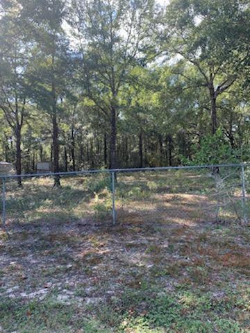 Great lot ready to build your forever home. Beautiful Oak Trees throughout and chain link fence around the outer perimeters of the lot.Note chain link will need to be run straight back to lot.line.Area at back where fenced runs across adjoing lot does not covey
