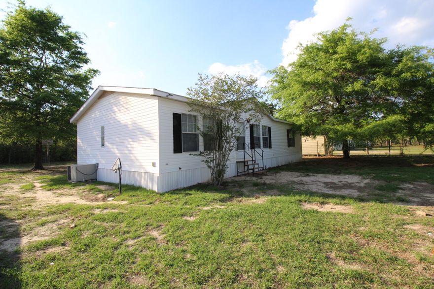 REO AS-IS *SELLER FINANCING AVAILABLE TO MOST BUYERS* Updated with new paint and new flooring, this home offers a brand new feel for an affordable price. Open living space with breakfast bar and wood burning fireplace. Garden tub, separate shower, and walk in closet in the master. Split floorplan with 2 additional bedrooms and a second full bath. Large, Level lot, partially fenced. *All measurements approximate*