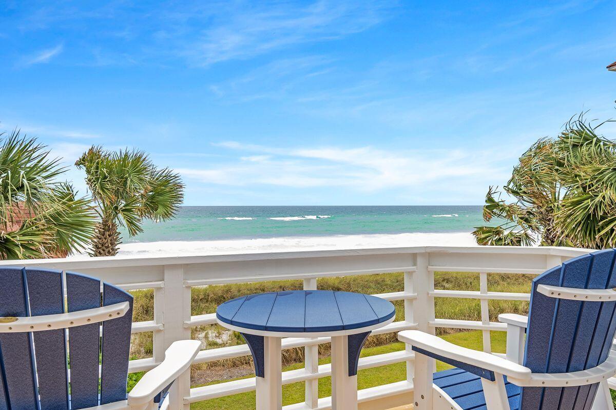 For anyone serious about living on the beach, this three-story gulf-front home does it in grand style. Set back behind a low picket fence, the first-floor terrace overlooks the grassy yard, white sand dunes and glittering blue water. The breathtaking gulf views get even more panoramic from the upper balconies. Imagine awakening to the gentle sound of the sea as you step out onto the balcony from the second-floor master bedroom to greet each new day.