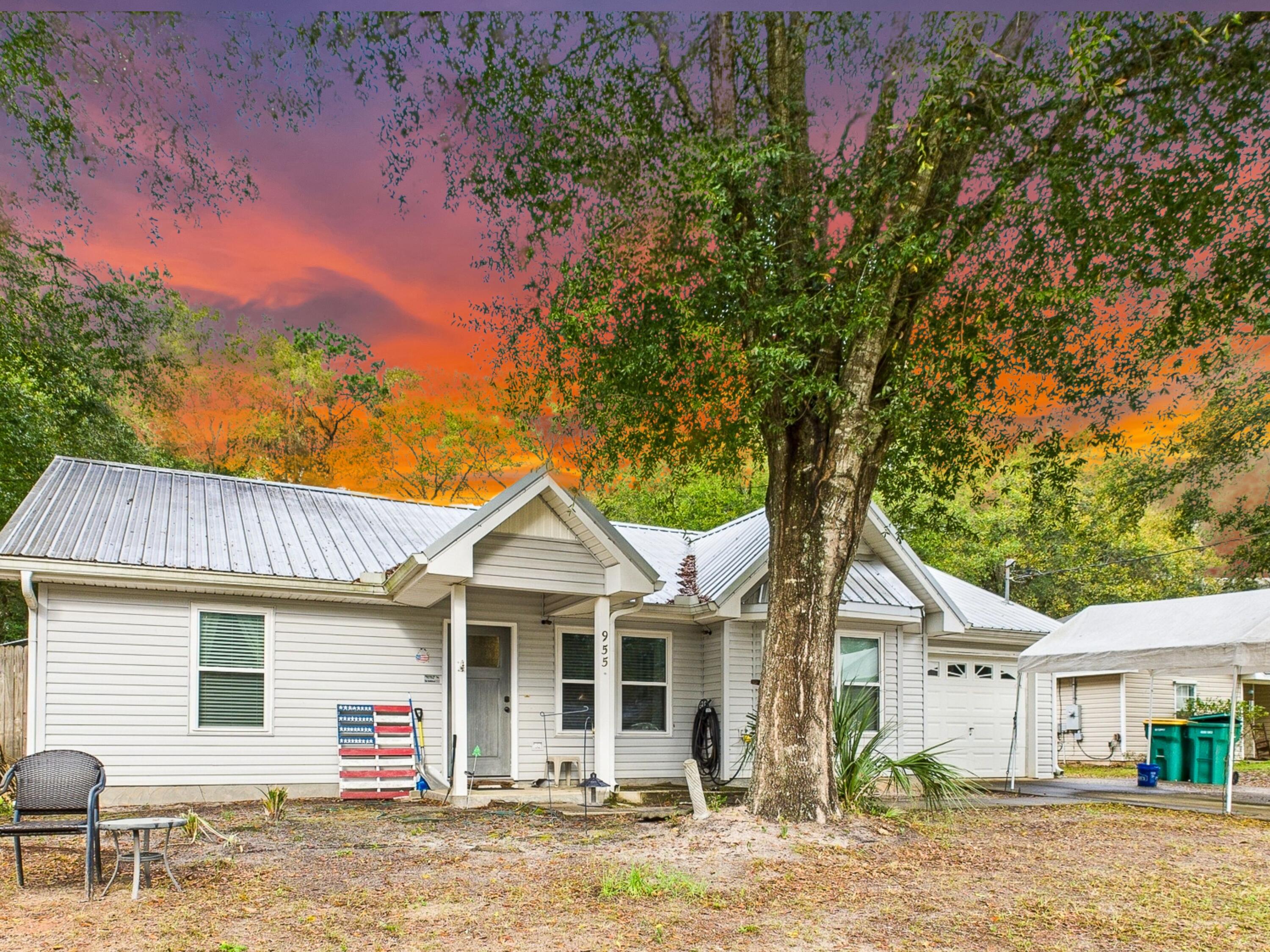 Discover this charming 3-bedroom, 2-bath home on an oversized lot just 2 miles from Crestview High School, 2.4 miles from Davidson Middle School, and 2 miles from local grocery shopping. The fenced-in backyard offers privacy, while the large workshop--complete with a separate storage room and wood-burning stove--is perfect for projects or extra storage. A durable metal roof and a tankless water heater provide long-term efficiency. Plus, the 1-car garage adds convenience. Don't miss this well-located gem with space to live, work, and play!
